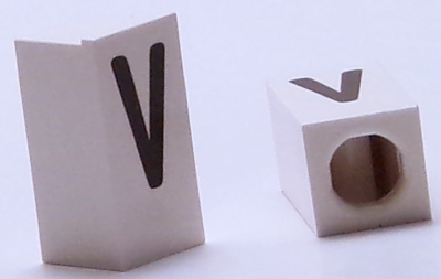 Tile, Modified 1 x 2 x 5/6 Stud Hole in End with Black Capital Letter V Pattern