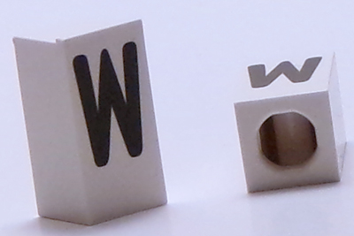 Tile, Modified 1 x 2 x 5/6 Stud Hole in End with Black Capital Letter W Pattern