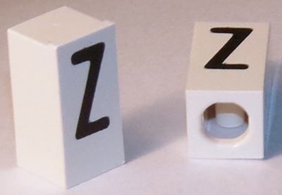 Tile, Modified 1 x 2 x 5/6 Stud Hole in End with Black Capital Letter Z Pattern