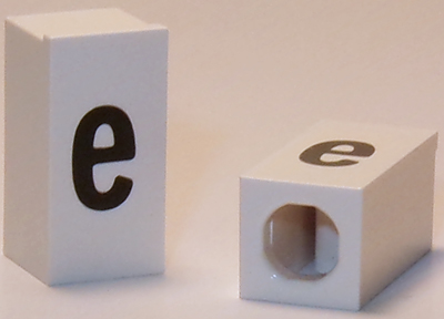 Tile, Modified 1 x 2 x 5/6 Stud Hole in End with Black Lowercase Letter e Pattern