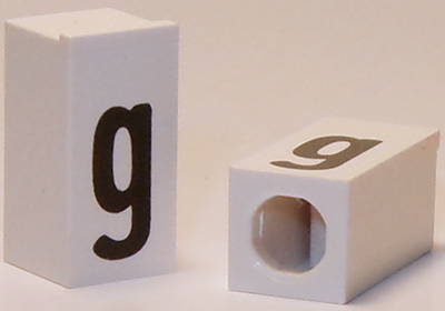 Tile, Modified 1 x 2 x 5/6 Stud Hole in End with Black Lowercase Letter g Pattern