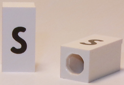 Tile, Modified 1 x 2 x 5/6 Stud Hole in End with Black Lowercase Letter s Pattern