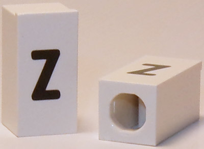 Tile, Modified 1 x 2 x 5/6 Stud Hole in End with Black Lowercase Letter z Pattern