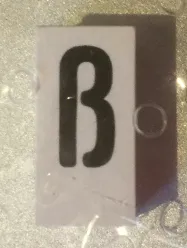 Tile, Modified 1 x 2 x 5/6 Stud Hole in End with Black Lowercase Letter Sharp s (ß) Pattern