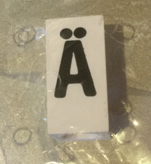 Tile, Modified 1 x 2 x 5/6 Stud Hole in End with Black Capital Letter A with Diaeresis (Ä) Pattern