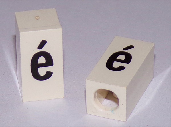 Tile, Modified 1 x 2 x 5/6 Stud Hole in End with Black Lowercase Letter e with Acute (é) Pattern