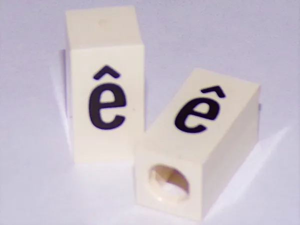 Tile, Modified 1 x 2 x 5/6 Stud Hole in End with Black Lowercase Letter e with Circumflex (ê) Pattern