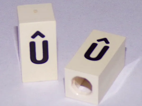 Tile, Modified 1 x 2 x 5/6 Stud Hole in End with Black Lowercase Letter u with Circumflex (û) Pattern