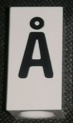 Tile, Modified 1 x 2 x 5/6 Stud Hole in End with Black Capital Letter A with Ring (Å) Pattern