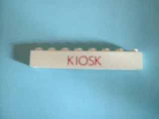Brick 1 x 8 without Bottom Tubes with Cross Side Supports with Red 'KIOSK' Thin (Letters Close) Pattern