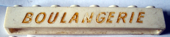 Brick 1 x 8 without Bottom Tubes with Cross Side Supports with Gold 'BOULANGERIE' Thin Slanted Pattern