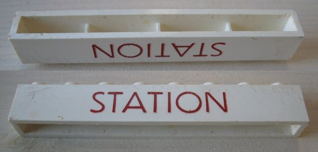 Brick 1 x 8 without Bottom Tubes with Cross Side Supports with Red 'STATION' Thin Small Pattern