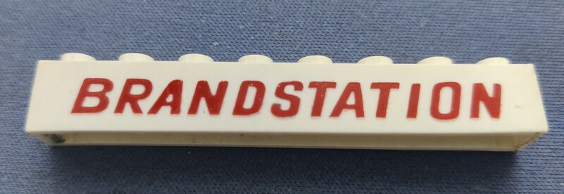 Brick 1 x 8 without Bottom Tubes with Cross Side Supports with Dark Red 'BRANDSTATION' Pattern