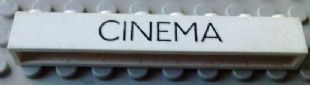 Brick 1 x 8 without Bottom Tubes with Cross Side Supports with Black 'CINEMA' Thin (Letters Close) Pattern