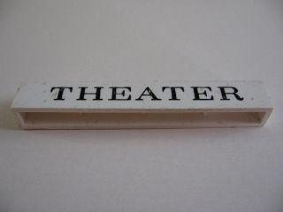 Brick 1 x 8 without Bottom Tubes with Cross Side Supports with Black 'THEATER' Serif Pattern