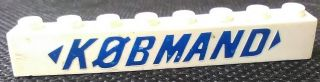 Brick 1 x 8 without Bottom Tubes with Cross Side Supports with Blue 'KOBMAND' and 2 Arrows Pattern (KØBMAND)