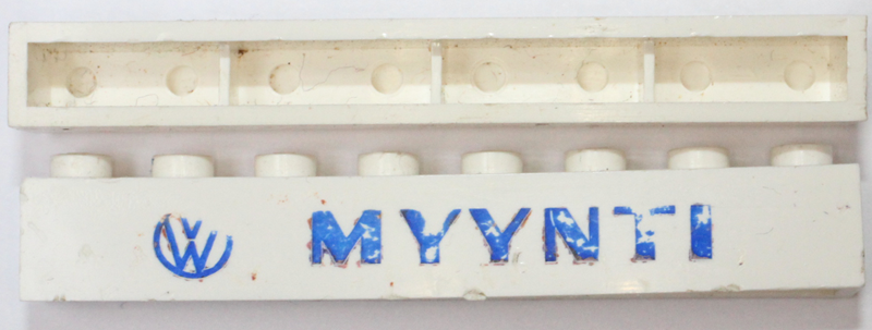Brick 1 x 8 without Bottom Tubes with Cross Side Supports with Blue 'VW MYYNTI' Pattern