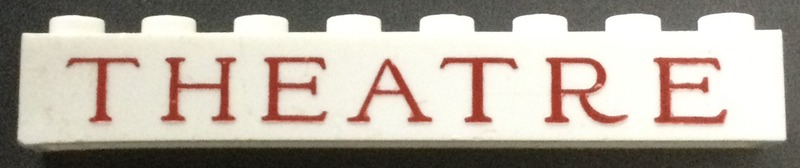 Brick 1 x 8 without Bottom Tubes with Cross Supports with Red 'THEATRE' Thin Serif Pattern