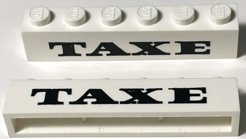 Brick 1 x 6 without Bottom Tubes with Cross Side Supports with Black 'TAXE' Serif Bold Medium Pattern