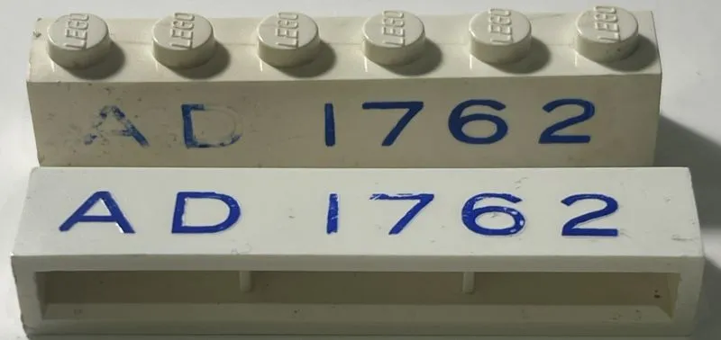 Brick 1 x 6 without Bottom Tubes with Cross Side Supports with Blue 'AD 1762' Pattern