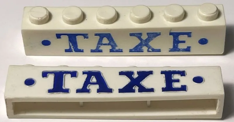 Brick 1 x 6 without Bottom Tubes with Cross Side Supports with Blue 'TAXE' Serif Bold Large and Dots Pattern
