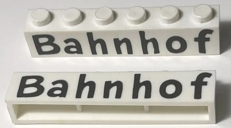 Brick 1 x 6 without Bottom Tubes with Cross Side Supports with Black 'Bahnhof' Comic Sans Pattern