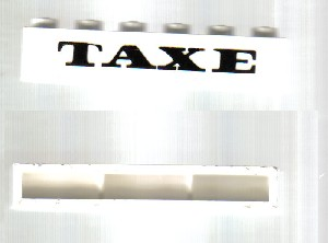 Brick 1 x 6 without Bottom Tubes with Cross Side Supports with Black 'TAXE' Pattern