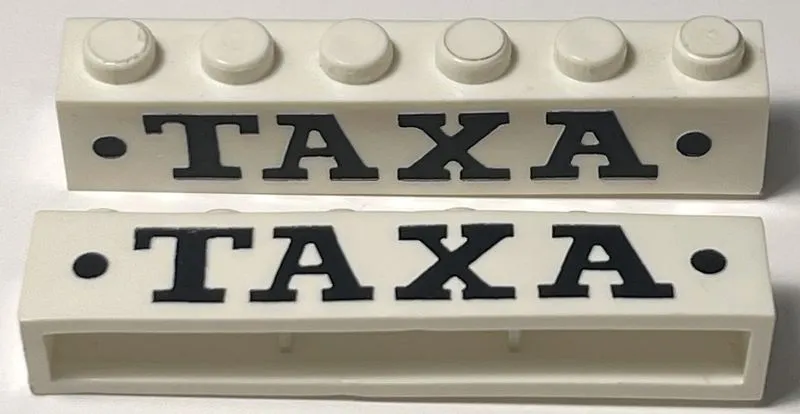 Brick 1 x 6 without Bottom Tubes with Cross Side Supports with Black 'TAXA' Serif Bold Large and Dots Pattern