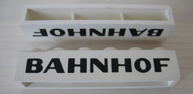 Brick 1 x 6 without Bottom Tubes with Cross Side Supports with Black 'BAHNHOF' Sans-Serif Pattern