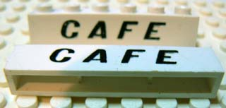 Brick 1 x 6 without Bottom Tubes with Cross Side Supports with Black 'CAFE' Slanted Pattern