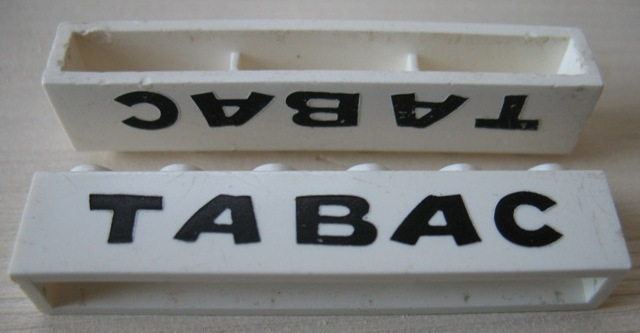 Brick 1 x 6 without Bottom Tubes with Cross Side Supports with Black 'TABAC' Pattern