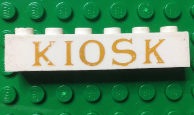 Brick 1 x 6 without Bottom Tubes with Cross Side Supports with Gold 'KIOSK' Serif Pattern